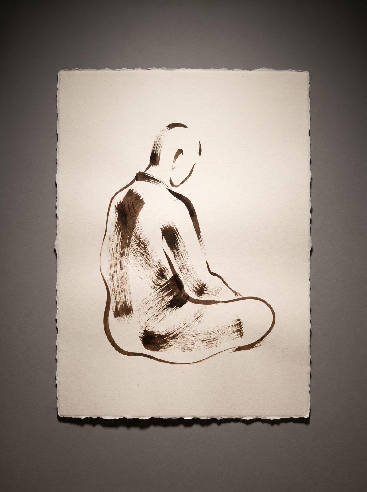 Minimalist seated figure drawing in warm brown ink drybrush on cream paper
